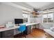Bright home office with built-in desk, storage shelves, natural light and wood floors at 190 W Archer Pl, Denver, CO 80223