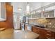 Contemporary kitchen featuring stainless steel appliances, stylish backsplash, and ample counter space at 190 W Archer Pl, Denver, CO 80223