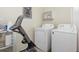Functional laundry area with a washer, dryer, and space for folding clothes at 190 W Archer Pl, Denver, CO 80223