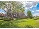 Spacious backyard featuring a lush green lawn and wooden privacy fence at 11321 N Brownstone Dr, Parker, CO 80138