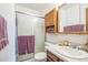 Bathroom features a vanity with storage and a stand-up shower with glass doors at 11321 N Brownstone Dr, Parker, CO 80138