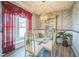 Bright dining room featuring decorative wallpaper, stylish lighting, and large window at 11321 N Brownstone Dr, Parker, CO 80138