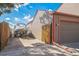 Long driveway leading to the garage, with side yard space for boat or RV parking at 11321 N Brownstone Dr, Parker, CO 80138