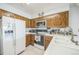 Traditional kitchen with wooden cabinetry and ample counter space at 11321 N Brownstone Dr, Parker, CO 80138