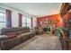 Comfortable living room featuring a fireplace, plush seating and large windows at 11321 N Brownstone Dr, Parker, CO 80138