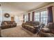 Spacious living room with natural light and comfortable furnishings at 11321 N Brownstone Dr, Parker, CO 80138