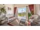 Enclosed sun room that looks out onto the backyard deck at 11321 N Brownstone Dr, Parker, CO 80138