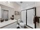 Bathroom featuring walk-in shower with glass door, modern sink, and neutral wall color at 4475 Hidden Gulch Rd, Castle Rock, CO 80104