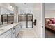 Bright bathroom featuring double vanity and large walk-in shower with modern finishes at 4475 Hidden Gulch Rd, Castle Rock, CO 80104