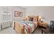 Comfortable bedroom featuring a wooden bed frame with unique decorations and natural lighting at 4475 Hidden Gulch Rd, Castle Rock, CO 80104