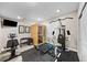 Home gym featuring exercise equipment, sauna, and ample workout space at 4475 Hidden Gulch Rd, Castle Rock, CO 80104