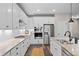 Modern kitchen featuring white cabinets, stainless steel appliances, and granite countertops at 4475 Hidden Gulch Rd, Castle Rock, CO 80104