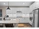 Bright kitchen with stainless steel appliances, granite countertops, and modern fixtures at 4475 Hidden Gulch Rd, Castle Rock, CO 80104