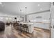 Open concept space with kitchen island, dining area, and living room at 4475 Hidden Gulch Rd, Castle Rock, CO 80104