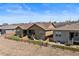 Backyard view with three homes, brown exteriors, turf, and fenced-in yards, perfect for outdoor living and entertaining at 4475 Hidden Gulch Rd, Castle Rock, CO 80104