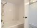 Bathroom featuring shower and tub combo with neutral tile at 12174 Melody Dr # 203, Westminster, CO 80234