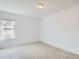 Bright bedroom with a large window for natural light and neutral colored carpet at 12174 Melody Dr # 203, Westminster, CO 80234