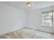 Bright bedroom with a large window for natural light and neutral colored carpet at 12174 Melody Dr # 203, Westminster, CO 80234