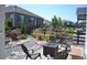 Serene backyard with a fire pit, comfortable seating, and landscaped surroundings, perfect for outdoor relaxation at 9028 S Catawba St, Aurora, CO 80016