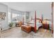 Spacious bedroom features a large bay window, wood floors, and a four-poster bed at 9028 S Catawba St, Aurora, CO 80016