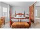 Beautiful bedroom features hardwood floors, large windows, and a rustic sliding barn door at 9028 S Catawba St, Aurora, CO 80016