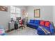 Comfortable bedroom space with a sleeper sofa and home office setup at 9028 S Catawba St, Aurora, CO 80016