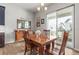 Dining room showcasing natural light, wood floors, and access to the outdoor living space at 9028 S Catawba St, Aurora, CO 80016