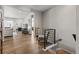 Open-concept hallway leading to living room with fireplace at 9028 S Catawba St, Aurora, CO 80016