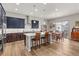 Modern kitchen boasts stainless steel appliances, custom cabinets, granite countertops, and a center island with seating at 9028 S Catawba St, Aurora, CO 80016