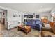 Spacious living room features an open floor plan, wood floors, and plenty of natural light at 9028 S Catawba St, Aurora, CO 80016