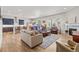 Spacious living room features an open floor plan, wood floors, fireplace, and plenty of natural light at 9028 S Catawba St, Aurora, CO 80016