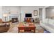 Cozy living room with a fireplace, comfortable seating, and natural light at 9028 S Catawba St, Aurora, CO 80016