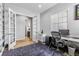 Bright office space featuring light-colored hardwood flooring and gray walls at 9028 S Catawba St, Aurora, CO 80016