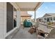 Covered patio offers a peaceful outdoor retreat with a grill and seating area for enjoying the backyard views at 9028 S Catawba St, Aurora, CO 80016