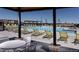 Community pool with lounge seating, pergolas, and tables with chairs at 9028 S Catawba St, Aurora, CO 80016