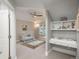 This cozy Bedroom has a crib, a changing table, and storage shelves at 18 Foxtail Cir, Englewood, CO 80113