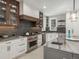 Spacious kitchen with granite countertops, stainless steel appliances, and ample cabinet space at 18 Foxtail Cir, Englewood, CO 80113