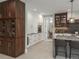 Spacious kitchen with custom cabinets, modern appliances, and breakfast bar seating at 18 Foxtail Cir, Englewood, CO 80113