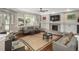 Cozy living room with large window, fireplace, and comfortable seating at 18 Foxtail Cir, Englewood, CO 80113