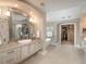 The main bathroom has dual vanities, a soaking tub, a glass shower, and a walk-in closet at 18 Foxtail Cir, Englewood, CO 80113