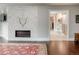The primary bedroom features a marble fireplace and leads into the bathroom and closet at 18 Foxtail Cir, Englewood, CO 80113