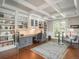 Bright office with custom built-ins, coffered ceiling, and ample workspace at 18 Foxtail Cir, Englewood, CO 80113