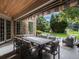 Covered outdoor patio with dining area and lounge furniture, perfect for entertaining and relaxation at 18 Foxtail Cir, Englewood, CO 80113