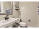 Well-lit bathroom with a modern vanity, sink, and toilet, offering a clean and functional space at 3344 Carabiner St, Castle Rock, CO 80108