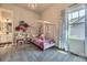 Adorable pink bedroom with a chandelier, canopy bed, and soft decor, ideal for a  at 3344 Carabiner St, Castle Rock, CO 80108