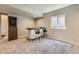 Stylish living room with bar area, window and recessed lighting over plush carpet at 3344 Carabiner St, Castle Rock, CO 80108