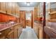 Butler's pantry showcasing wood cabinets, countertop space, and a sink at 3999 Evans Ranch Rd, Evergreen, CO 80439