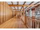 Hallway featuring wood floors and natural light at 3999 Evans Ranch Rd, Evergreen, CO 80439