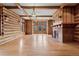 Living room highlighting wood floors, beamed ceilings, and fireplace at 3999 Evans Ranch Rd, Evergreen, CO 80439
