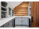 Walk-in pantry featuring custom cabinetry and a countertop at 3999 Evans Ranch Rd, Evergreen, CO 80439
